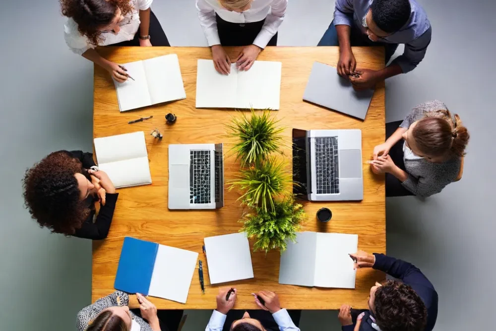 Group of individuals collaborating around a table